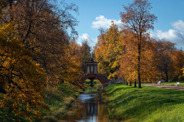 Cross bridge (Krestovy bridge) in the Alexander Park of Tsarskoye Selo on a sunny autumn day,...