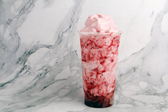Freshly made strawberry flavored iced frappe