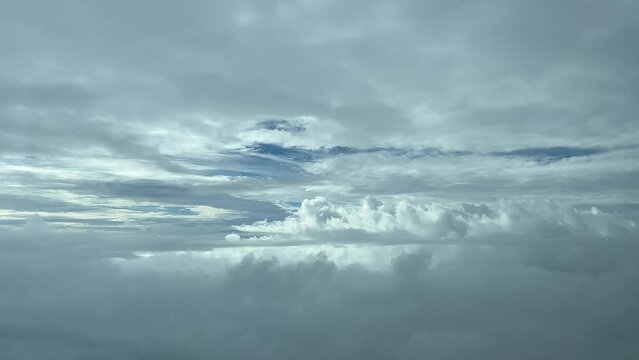 Pilot point of view from a jet cockpit flying through a turbulent sky at 10000m high with a left turn. 4K.