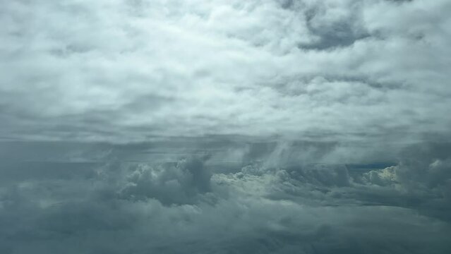 Jet cockpit point of view flying through a turbulent sky in a cold winter day with sunbeams. Pilot point of view. 4k