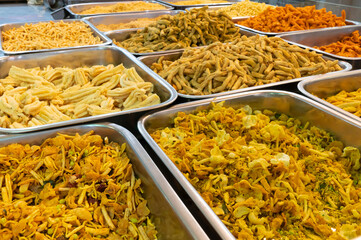 Bhujia, a spicy deep-fried sev filled with a burst of flavors, made using gram flour, moth flour, and different spices, crispy & crunchy traditional namkeen being sold in Jodhpur, Rajasthan, India.