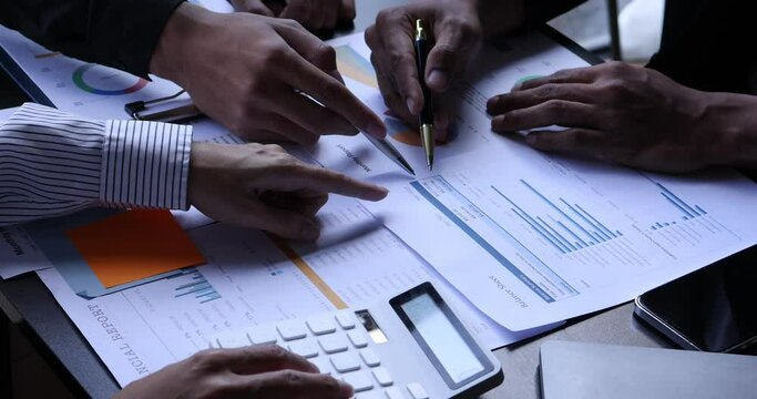 4k video footage of a group of Business people discuss investment project working on Statistical analysis and accounting of annual financial data of enterprises employee.