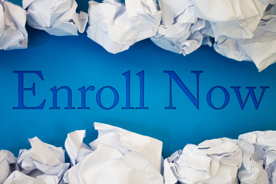 Enroll Now text with Torn, Crumpled White Paper on colored background.