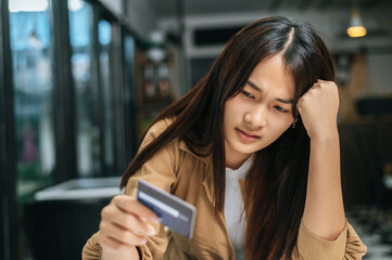 Young businesswoman paying order having contactless payment with cardit card