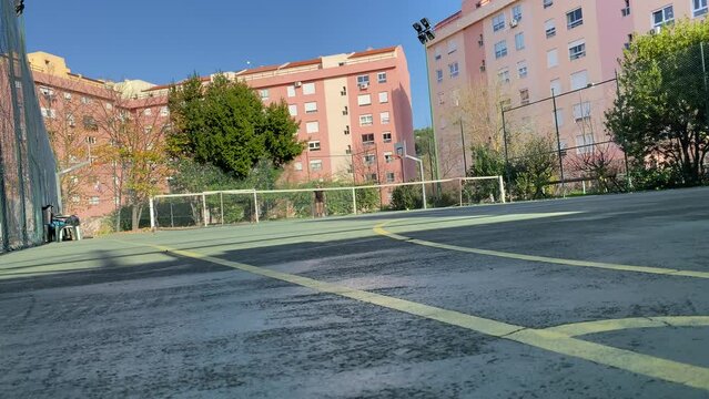 Professional tennis player hitting forehands and gets disappointed after losing a rally in match in Lisbon