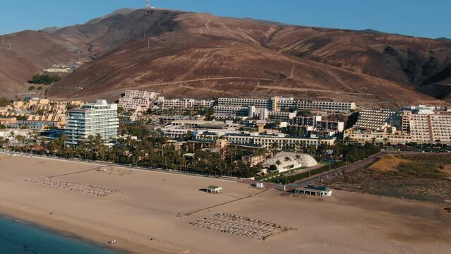 Aerial shot over the Matorral beach and where you can see the tourist buildings in the area. On the island of Fuerteventura, Canary Islands.