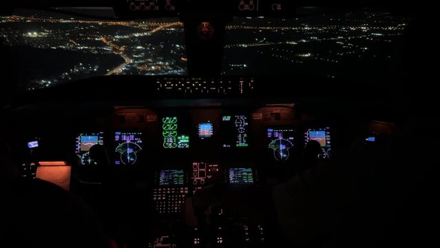Unique cockpit view during a real  night approach to Athens airport overflying the city.