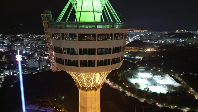 Illuminated Daegu tower 83 iconic Korean observation deck landmark aerial orbiting view