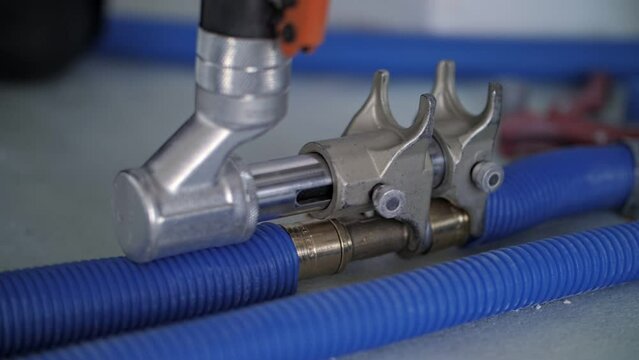 workers connect the heating pipes