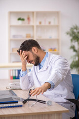 Young male doctor working in the clinic