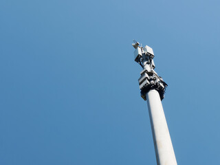 Steel cell tower antenna on blue sky background