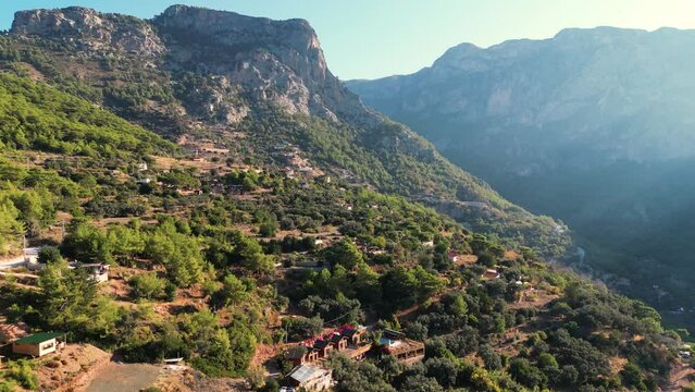 aerial view of houses in the mountain in a sunny day - Turkey
