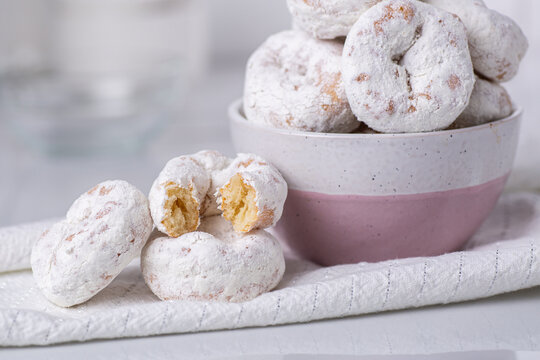 Close up of powdered sugar mini donuts