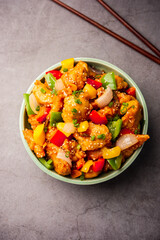 Chilli chicken which is a popular Indo-Chinese starter dish, served on a plate or bowl. Selective focus