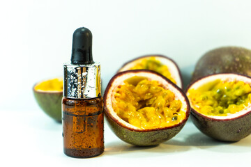 Passion fruit essential oil in a brown glass bottle, alternative medicine. Natural organic essence....