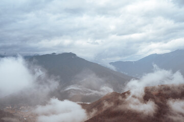 beautiful natural mountain background with clouds with space for text