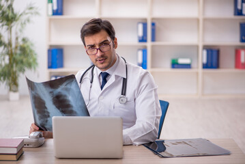 Young male doctor radiologist working in the clinic