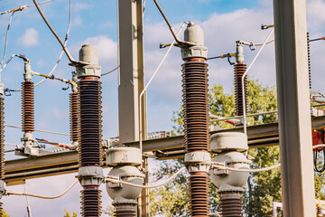 Current and voltage converter for an electrical substation. Dielectric insulator close-up. Transformation and transmission of electricity from generator to consumers - obrazy, fototapety, plakaty