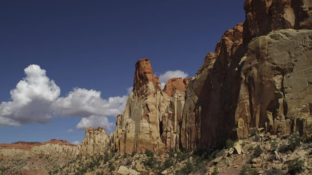 Low angle aerial flyover view of rock formations in Grand Staircase Escalante / Boulder, Utah, United States