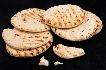 .Pita bread on dark background. Arabic, lebanese bread, traditional food.