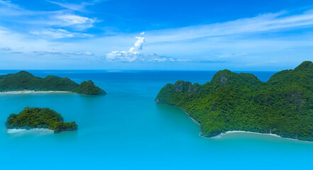 Aerial view of  tropical with seashore as the island in a coral reef ,blue and turquoise sea Amazing nature landscape with blue lagoon