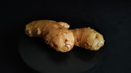 Ginger on black background. Ginger's photo on a black background. Isolated ginger image suitable for illustration of content related to ginger material. Isolated photo.