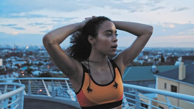 Fitness, tired and breathing with a black woman runner resting after a workout or exercise on a city bridge. Sports, health and exhausted with a female athlete taking a break while running in a town