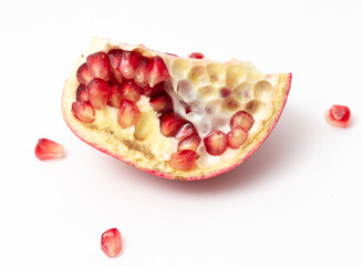 Juicy pomegranate berries isolated on white background.