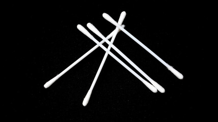 Isolated a couple pieces of cotton bud with black background.