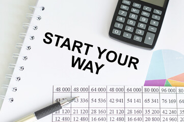 Start Your Way text on a notepad on a table among documents, a calculator and a pen