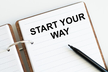 Start Your Way text on an open notebook on a desk, a business concept