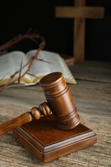 Judge gavel on old wooden table, closeup