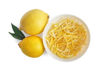 Bowl of lemon peel and fresh fruits on white background, top view. Citrus zest