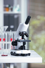 Modern medical microscope on white table in laboratory