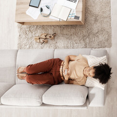 Black woman with smartphone, relax on couch and social media scroll overhead, taking break from...