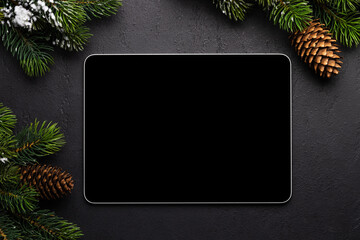 Tablet with blank screen and Christmas decor - obrazy, fototapety, plakaty