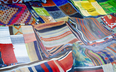 Colorful fabrics in a city market.