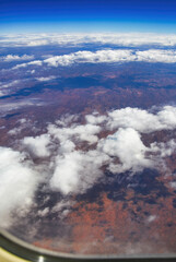 The Australian Outback as seen from the airplane window. Clouds in the sky