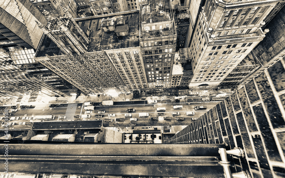 Sticker amazing skyscrapers in midtown manhattan, aerial view from rooftop with traffic reflections on the b