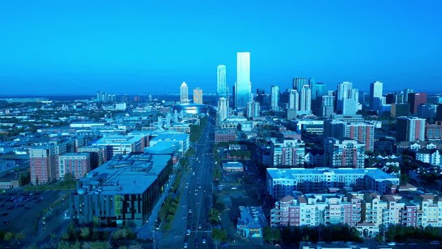 Downtown Edmonton aerial drone flyover McEwan University Norquest College residential main strip on 104th Avenue between 113th and 11th smooth slow light traffic sunny summer day 4k 2-3