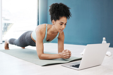 Wellness, fitness and yoga webinar on laptop for healthy and young black woman in body plank position. Focus, balance and online mindfulness in exercise class with girl on floor in home for health.