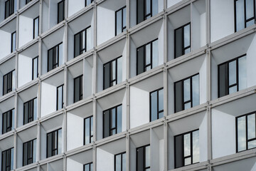 Abstract fragment of modern architecture, wall made of glass and concrete