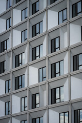 Abstract fragment of modern architecture, wall made of glass and concrete