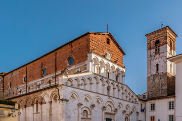 Fototapeta na wymiar The Church of Santa Maria Forisportam in the historic center of Lucca, Italy, on a sunny day