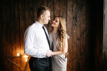 Happy smiling family at  studio on background of the Christmas tree with gift