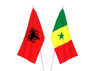 National fabric flags of Republic of Albania and Republic of Senegal isolated on white background. 3d rendering illustration.