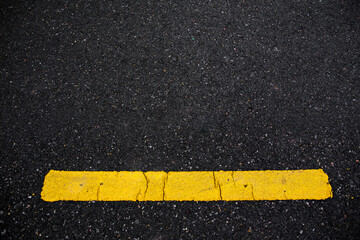 abstract Asphalt road surface with yellow line. texture for add text message or design art work....