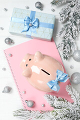 Concept of Christmas finance with piggy bank, top view