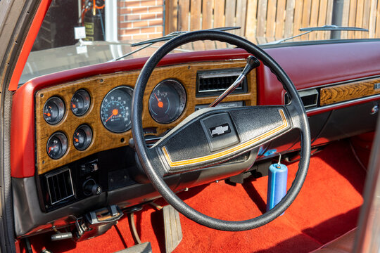 Chevrolet Silverado 1976 interior. Retro car, retro torpedo car, vintage steering wheel, speedometer. Snohomish, WA, USA - September 2022