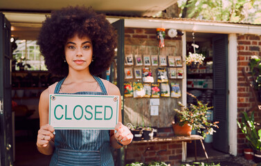 Closed sign, black woman and business failure for cafe, employee and worker with end of day. African American girl, female entrepreneur and owner holding poster for bankrupt store, company closure.